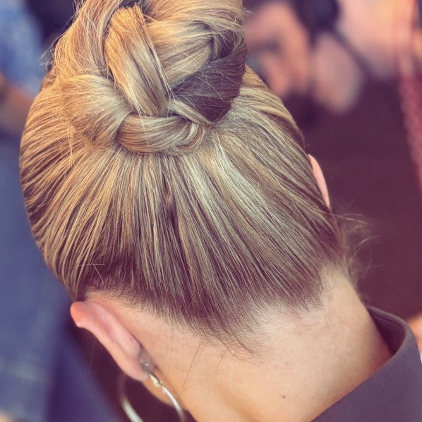 Image of model with hair style by @carlymediamakeup, a beautiful updo using Giovanni Eco Chic Beauty styling products