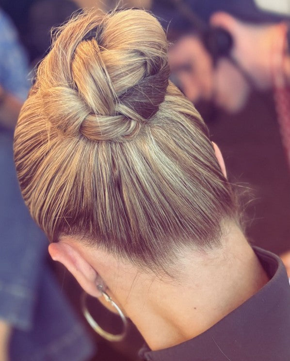 Image of model with hair style by @carlymediamakeup, a beautiful updo using Giovanni Eco Chic Beauty styling products