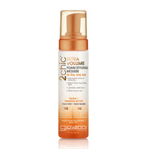A white bottle of Giovanni Cosmetics 2chic® ULTRA-VOLUME FOAM STYLING MOUSSE, color-safe and ideal for fine, limp hair, with orange accents and a pump dispenser.
