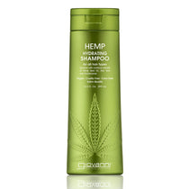 A green bottle of Giovanni Cosmetics HEMP HYDRATING SHAMPOO for all hair types features a large hemp leaf design and white text. This vegan shampoo, infused with Hemp Seed Oil, is available in 3 sizes (including 13.5 fl oz/399 mL).