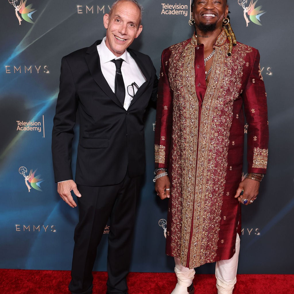 Giovanni Guidotti and Brian Steven Banks posing on the red carpet at the Emmys
