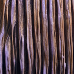 Image of Purple Conditioner combed through blonde hair