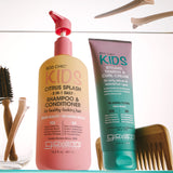 Image of two products - Giovanni's Citrus Splash 2-in-1 Shampoo and Conditioner and KIDS Styling, Taming & Curl Cream on a glass shelf in a bathroom setting. 

