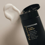 Image of Giovanni Professional Conditioner open with conditioner on surface