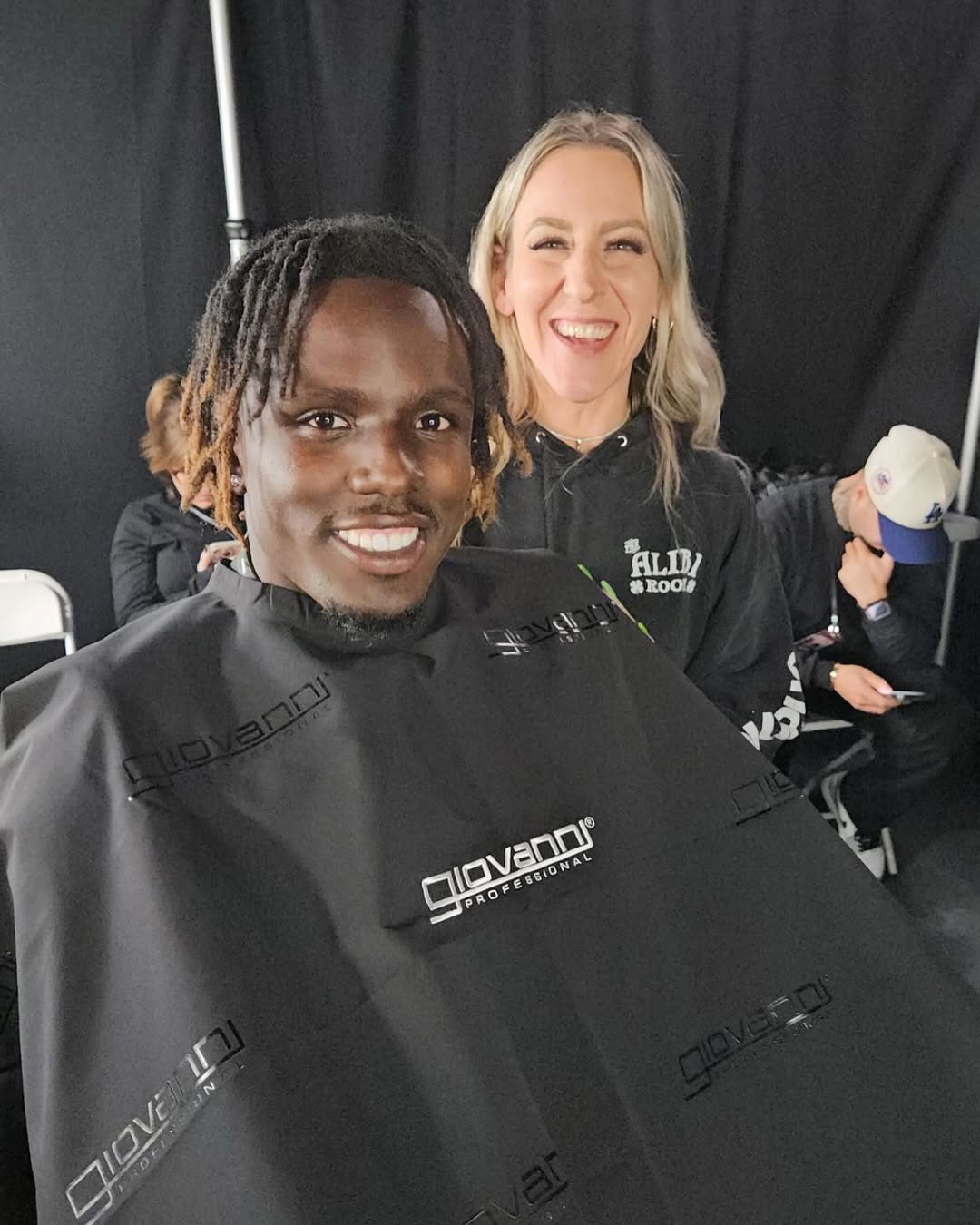 Person getting a haircut with a stylist